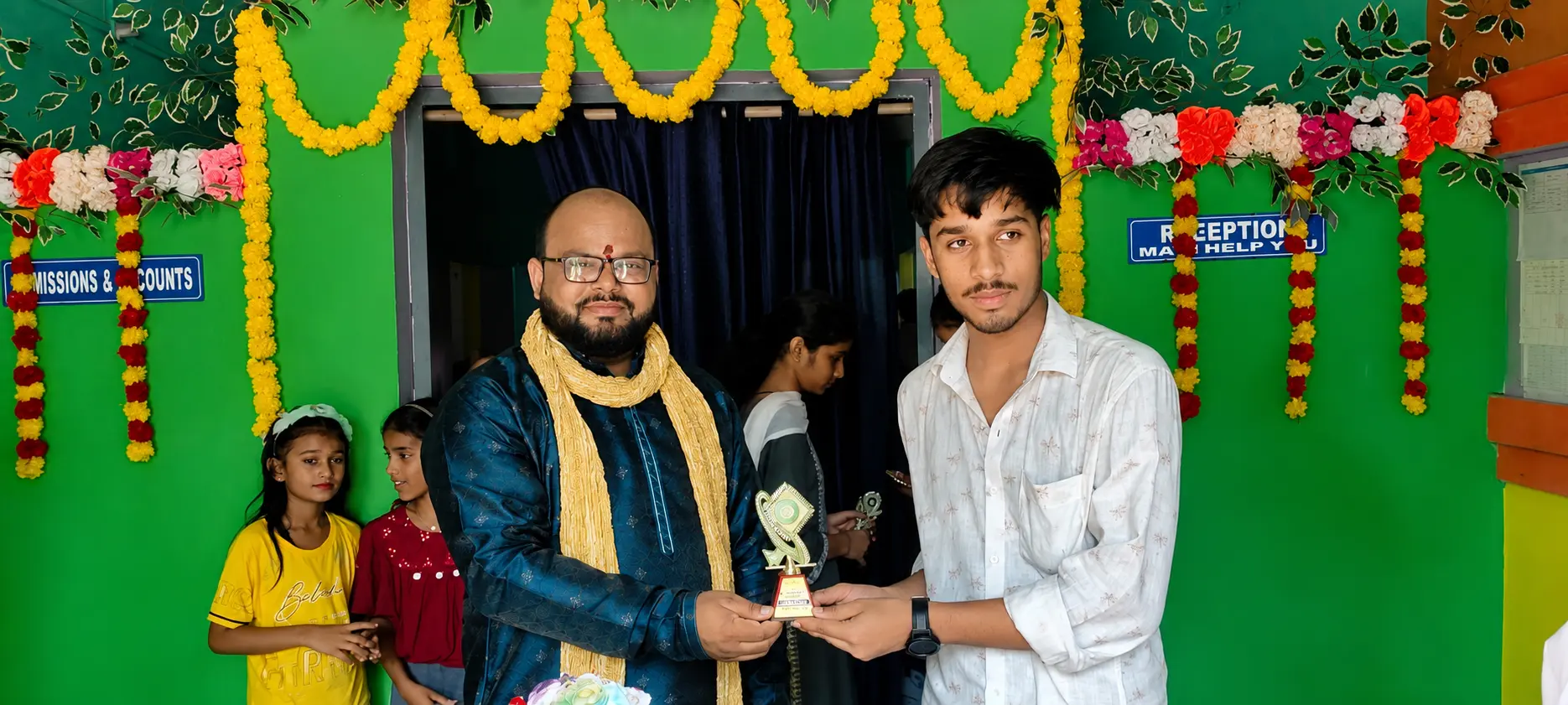 Principal giving gift to student